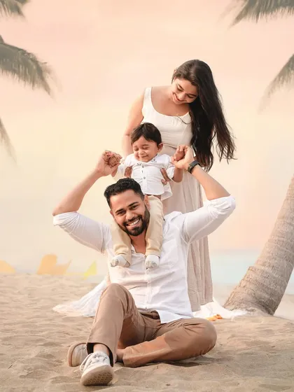 Another angle of this happy family moment on the beach. We move around to capture different perspectives, ensuring a varied and dynamic gallery of images.