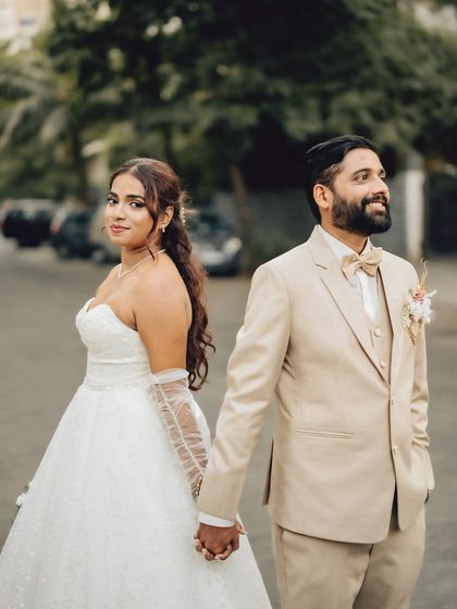 A classic walking pose with a modern twist. This shot captures the couple hand in hand, ready to step into their future together, perfect for a Goa wedding photoshoot.