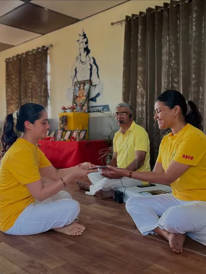 The graduation ceremony is a sacred moment. It marks the passing of the yoga baton, where a student receives their certificate and is empowered to share the light of this ancient knowledge with others.