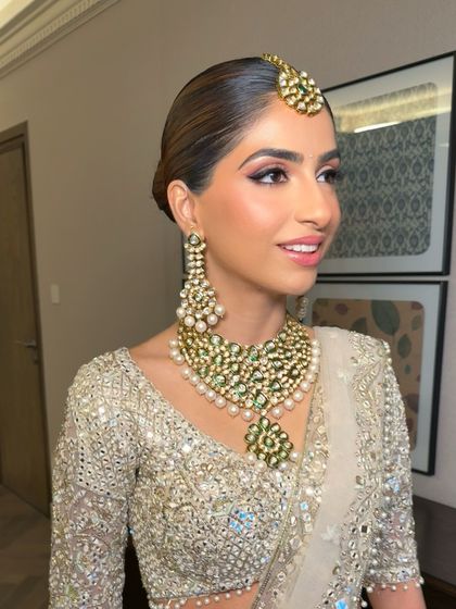 A profile view showing the soft, flushed complexion and defined eyes. This look was created using cream and liquid products to achieve a seamless, dewy finish that looks like second skin.