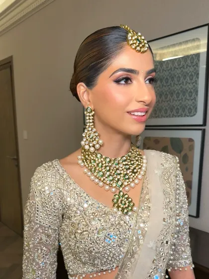 A profile view showing the soft, flushed complexion and defined eyes. This look was created using cream and liquid products to achieve a seamless, dewy finish that looks like second skin.