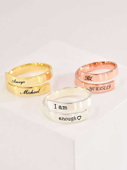 Our custom wrap rings aren't just for couples. You can engrave them with names, dates, or a personal mantra like "I am enough" or "Be yourself." Available in gold, silver, and rose gold.