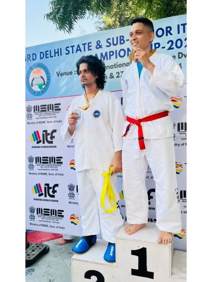 An adult student celebrates his silver medal win at the Delhi State Taekwondo Championship.