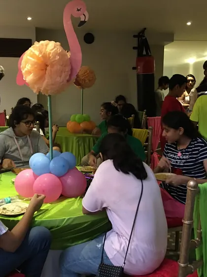 Happy guests enjoying their food fresh from the truck. I set up seating areas where everyone can gather, eat, and chat, making the dining experience casual and communal.