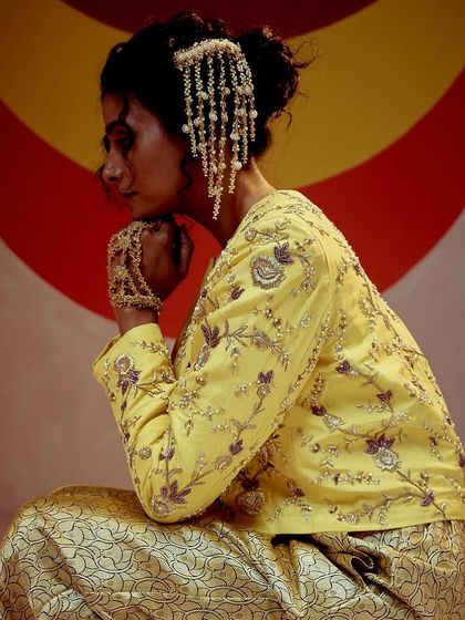 I love seeing my designs styled in unique ways. Here, our hair accessory is worn as a statement ear piece for a bold, contemporary look.