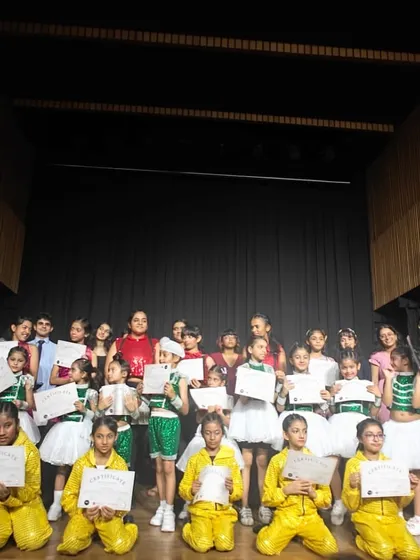 The UDC squad, united and proud! This is our entire cast from the 2024 recital, holding their certificates of achievement. This picture captures the sense of community and shared success that defines our studio.