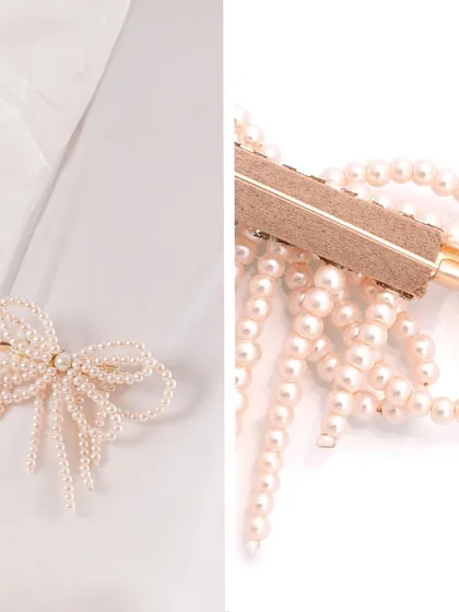 A closer look at our peach pearl bow brooch, showing it styled on a collar and the detail of the craftsmanship.