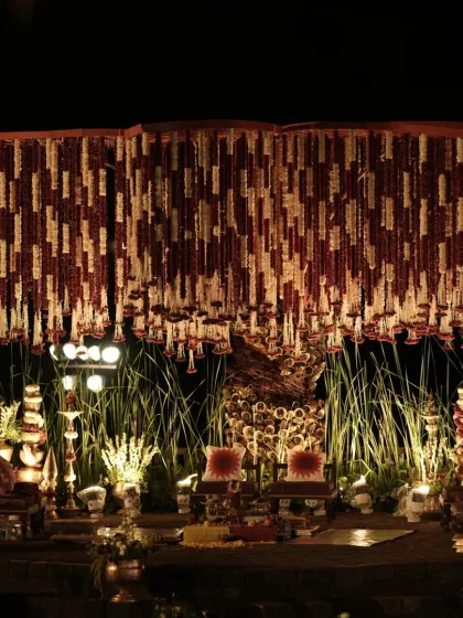 For this wedding, I brought the sacred spirit of the Banaras Ghats to life. The mandap featured a dense canopy of red and white floral strings, traditional brass bells, and an earthy, spiritual ambiance.