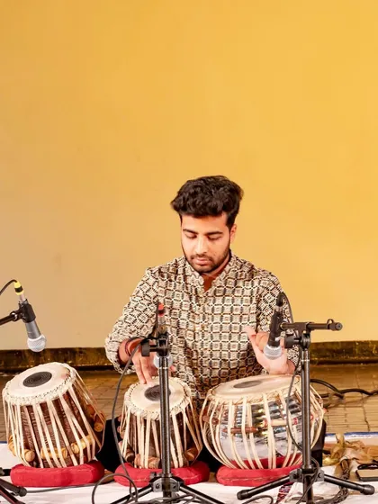 A focused shot during my solo recital, showcasing the traditional tabla and sarangi pairing.