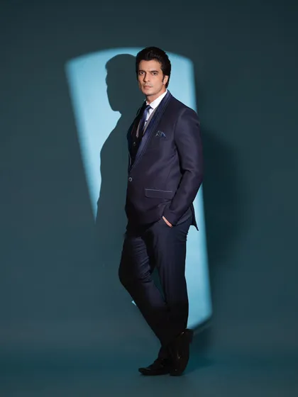 Styling Gashmeer Mahajani in a sleek navy blue three-piece suit for a commercial shoot. This look is all about sharp tailoring and a commanding presence.