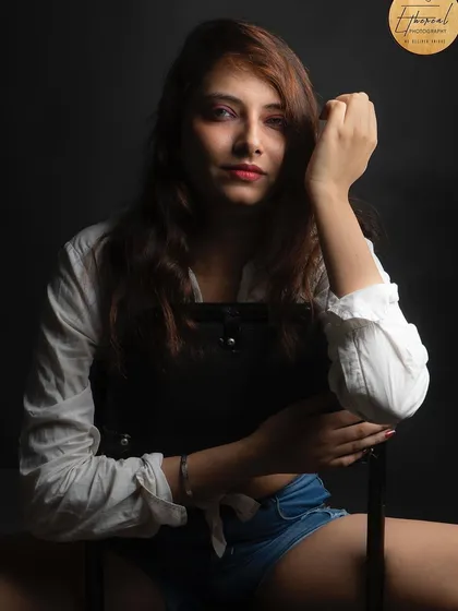 A powerful studio portrait with dramatic, low-key lighting. This style creates a sense of intimacy and intensity, perfect for an actor's headshot or a model's portfolio.