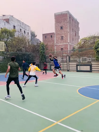 A player drives to the hoop, demonstrating speed and control.