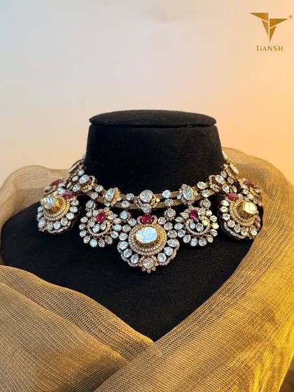 If you love old world charm with a new age presence, this Polki choker necklace is a dream crafted in deep hued rubies and intricate meenakari work. It is designed for the woman who carries tradition with modern confidence.