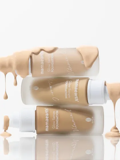A tower of foundation bottles with satisfying drips. This shot is all about showcasing the product's creamy texture and range of shades in a visually dynamic and appealing way.