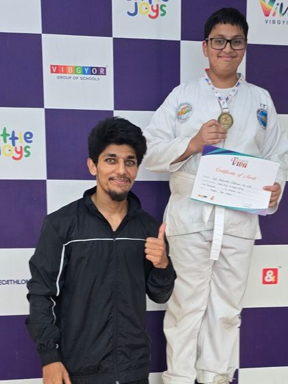 A proud moment with one of my students on the winner's podium at the VIVA Inter-School competition.
