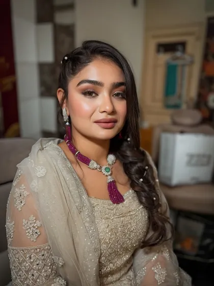 A close-up of the look, her eyes shining and her skin looking smooth.