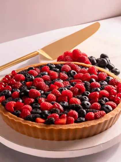Ready to serve! My Signature Berry Tart is perfect for sharing and makes a stunning centerpiece for any celebration. The vibrant colors of the fresh fruit make it a feast for the eyes.