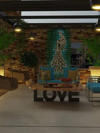 Another view of our peacock-themed terrace, showcasing the layout with illuminated planters, a mix of seating options, and stone-clad walls that add texture and warmth to the design.