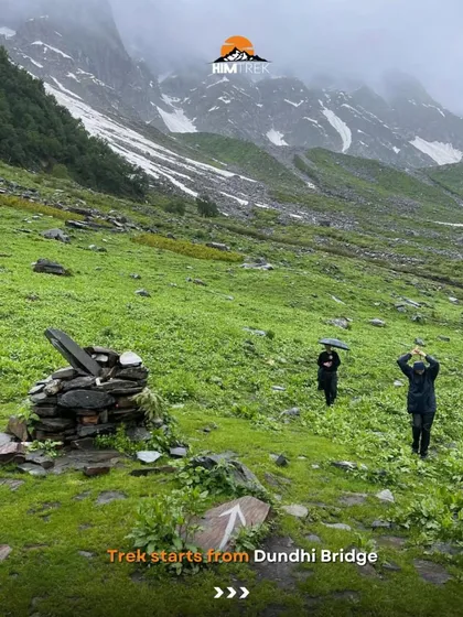 The Beas Kund trek starts from the Dhundi Bridge, and you're immediately greeted by green pastures and snowy peaks.