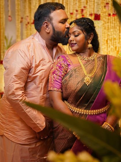 A romantic shot of Dr. Preetha and her fiancé. Her makeup looks flawless even in a candid, emotional moment.