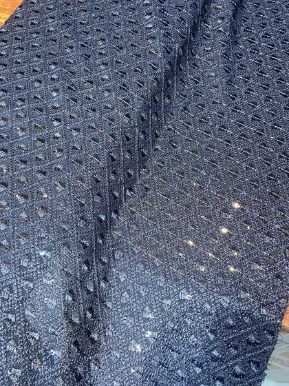 A deep navy blue Chikankari fabric with tonal embroidery and sequins. This is an excellent choice for creating a rich, formal kurta for evening wear.