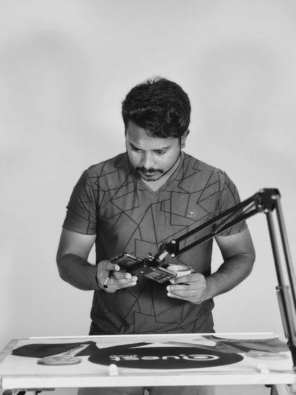 This is me, focused on the details of a drawing. Every piece is a journey, and this photo captures a moment of that process. The story behind this specific artwork is a reminder that hard work and passion always find a way to be seen.