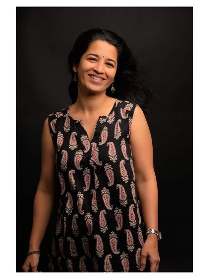 A similar portrait from the series, demonstrating consistency in capturing a warm and friendly demeanor.