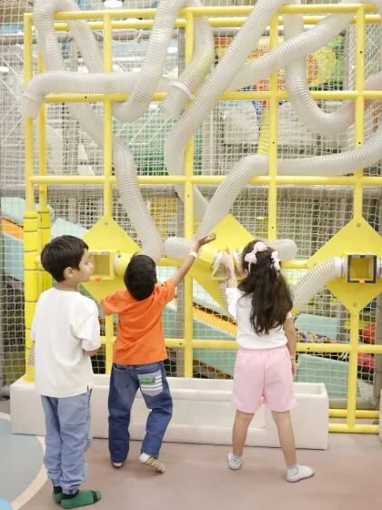 Children are fascinated by our air-tube wall, where they can send scarves flying through a maze of transparent tubes.