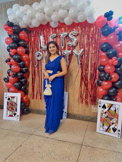 This stunning blue drape saree is a true investment piece. Its vibrant color and easy-to-wear silhouette make it perfect for countless occasions, from a friend's sangeet to a formal party.