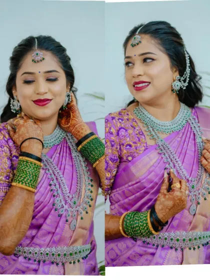 A happy client looking beautiful in a silver-finish AD stone set for her reception. The layered necklace and matching maang tikka perfectly complement her purple saree.