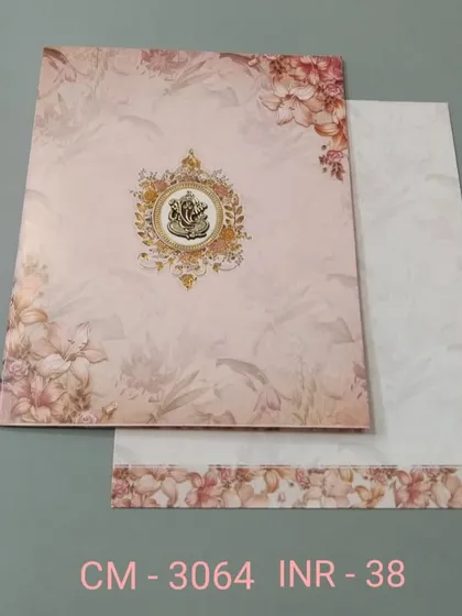 A simple and elegant invitation with a soft pink floral background and a Ganesha emblem. This affordable card is perfect for announcing your blessed union.