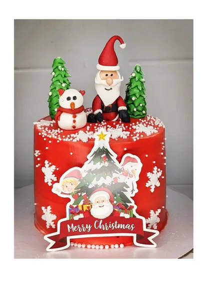 A very merry Christmas cake! This tall mixed fruit cake is decorated in festive red, with a handmade fondant Santa, snowman, and Christmas trees.