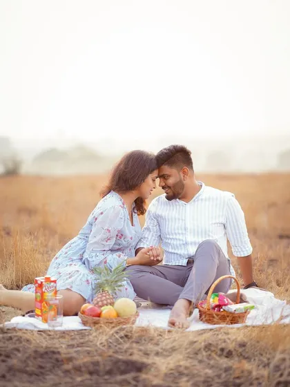 A classic romantic pose during the picnic-themed shoot. The beautiful composition and soft lighting make this a timeless pre-wedding photo.