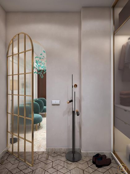 A walk-in space with an arched glass door and a unique geometric-patterned floor. The design feels both classic and modern.