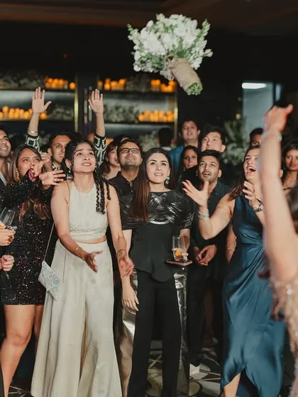The bride wanted a bouquet toss, but her way. We incorporated this fun tradition into the after-party, creating a moment of laughter and excitement for all her friends.