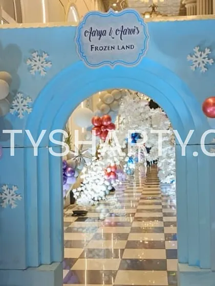 Your party experience begins with a grand entrance. For this Frozen-themed event, we constructed an enchanting tunnel of white cherry blossom trees and balloon arches, making guests feel like they're stepping into the magical kingdom of Arendelle.