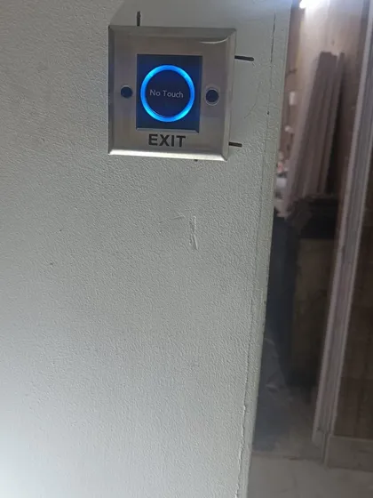 A 'No Touch' exit sensor installed in Noida. Users can exit by simply waving their hand in front of the sensor, which is a hygienic solution for high-traffic areas.