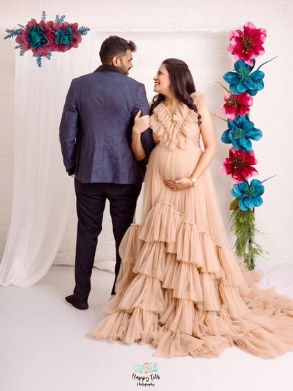 Capturing a sweet, interactive moment between the couple. The movement and loving gaze make this photo feel so alive and full of joy.