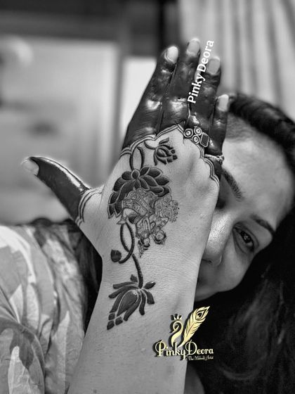A black and white shot of my self-applied mehndi. It highlights the patterns and the joy of being both the artist and the canvas.