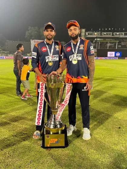 This is what dedication looks like. We are incredibly proud of our student Karan Sharma, captain of Kashi Rudras, holding the UP T20 trophy. His success is a testament to the hard work we value.