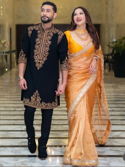 Confidence in motion. A full-length view of the custom-fitted black sherwani, designed to look impeccable from every angle as you walk through your special day.