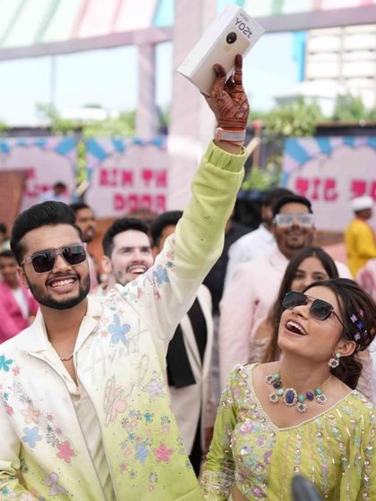 The couple having a blast at their carnival, taking a selfie to capture the fun-filled memories.