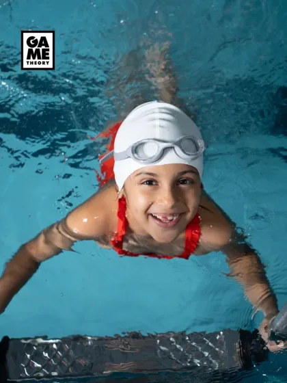 Look at that smile! This is what pure joy in the water looks like. Our swimming program for kids focuses on building confidence and having fun, one happy splash at a time.