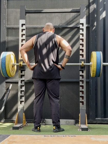The calm before the storm. A moment of focus before a heavy squat session. Prepare your mind for the battle ahead.