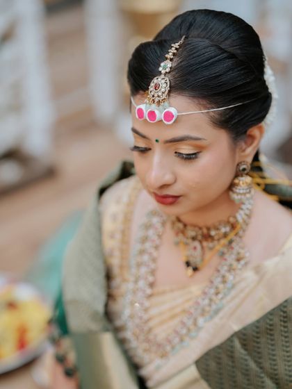 A close-up on the makeup, showing the golden shimmer on her eyes.
