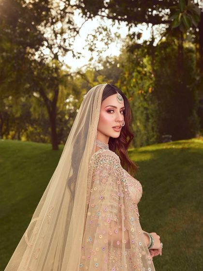 A dreamy shot of the bride with her veil. The soft, romantic makeup is perfect for the modern bride who wants to look like the best version of herself.