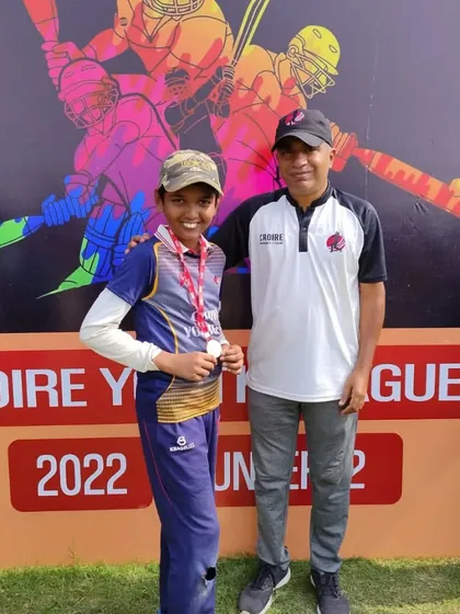 Another deserving player receiving his award from the coach.