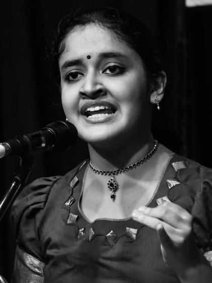 A black and white close-up from a concert at Bharatiya Vidya Bhavan. It captures the intensity and focus of the performance.
