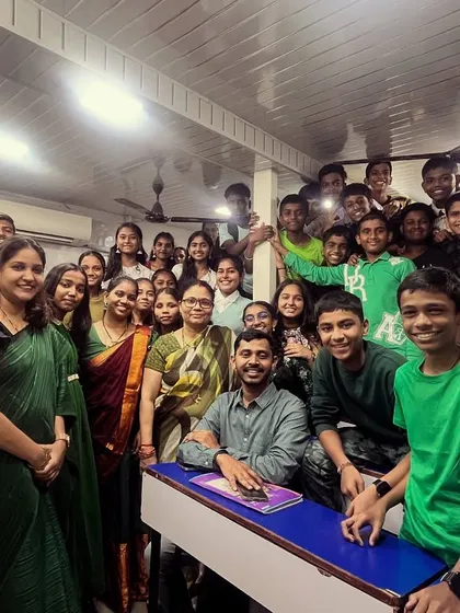 Another batch of students and teachers celebrating the green theme of Navratri, fostering a sense of community and shared joy.