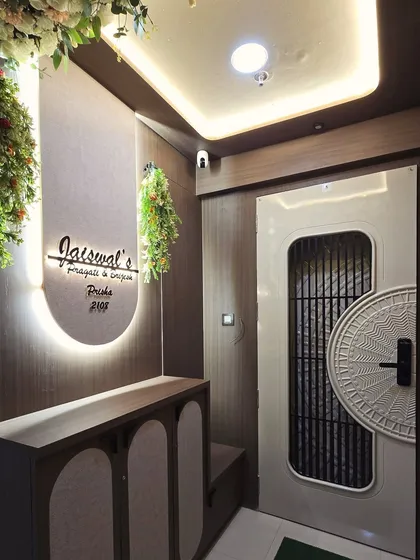 A great entrance sets the tone for the entire home. Here, I designed a complete lobby with a custom backlit nameplate, a sleek shoe cabinet, and a stylish safety door that combines security with modern aesthetics.